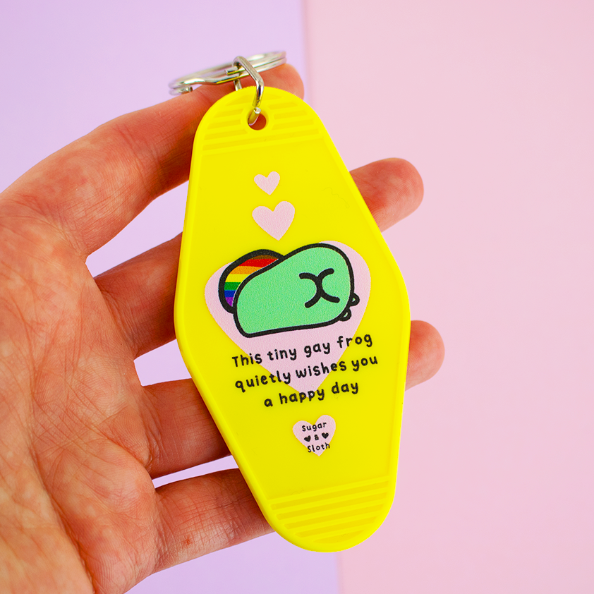 This Tiny Gay Frog Quietly Wishes You A Happy Day  Keyring