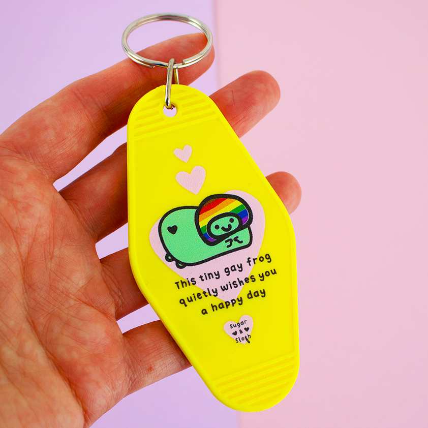 This Tiny Gay Frog Quietly Wishes You A Happy Day  Keyring